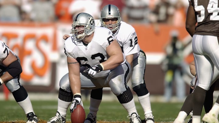 Barret Robbins snaps the ball to Rich Gannon
