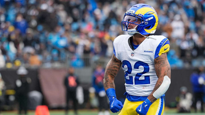 Los Angeles Rams running back Blake Corum (22) celebrates after scoring a touchdown during the second quarter against the Carolina Panthers at Bank of America Stadium. 