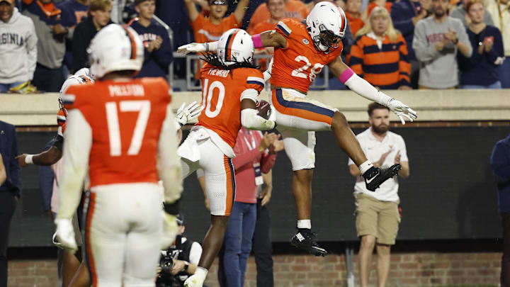 Oct 18, 2025; Charlottesville, Virginia, USA; Virginia Cavaliers defensive back Ja'Son Prevard (10) celebrates with Cavaliers defensive back Donavon Platt (28) after intercepting a pass against the Washington State Cougars in the fourth quarter at Scott Stadium. Mandatory Credit: Geoff Burke-Imagn Images