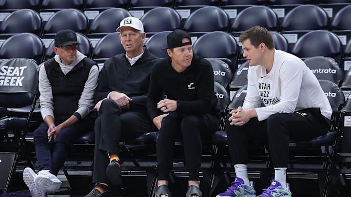 Feb 6, 2024; Salt Lake City, Utah, USA; From left to right, Utah Jazz general manager Justin Zanik, CEO Danny Ainge, owner Ryan Smith and head coach Will Hardy sit court side before the game between the Utah Jazz and the Oklahoma City Thunder at Delta Center. Mandatory Credit: Rob Gray-Imagn Images