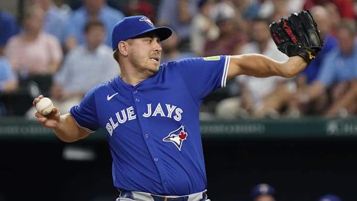 Sep 19, 2024; Arlington, Texas, USA; Toronto Blue Jays pitcher Erik Swanson (50) throws to the plate during the eighth inning against the Texas Rangers at Globe Life Field. 