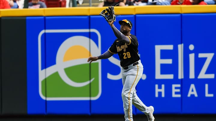 Apr 13, 2025; Cincinnati, Ohio, USA; Pittsburgh Pirates outfielder Alexander Canario (29) catches a fly out hit by Cincinnati Reds designated hitter Spencer Steer (not pictured) in the eighth inning at Great American Ball Park. Mandatory Credit: Katie Stratman-Imagn Images