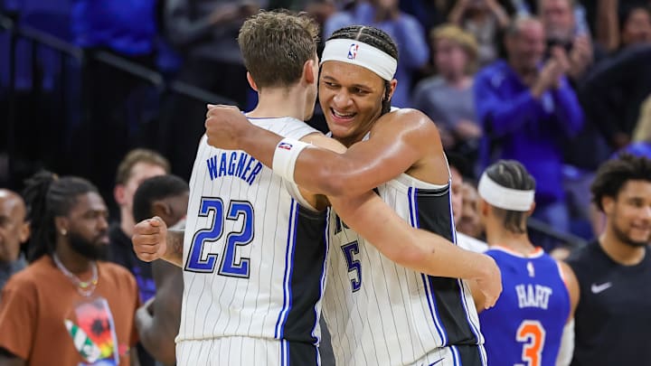Dec 29, 2023; Orlando, Florida, USA; Orlando Magic forward Franz Wagner (22) and forward Paolo Banchero (5) celebrate their 117-108 win against the New York Knicks at KIA Center. Mandatory Credit: Mike Watters-Imagn Images