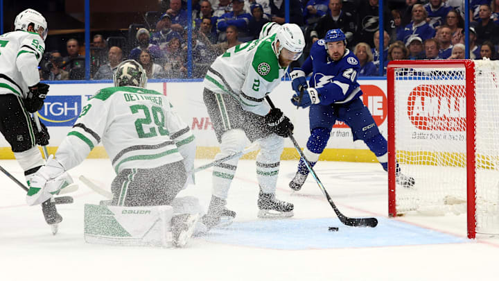 Dec 4, 2023; Tampa, Florida, USA; Dallas Stars defenseman Jani Hakanpaa (2) defends the puck against the Tampa Bay Lightning during the third period at Amalie Arena. Mandatory Credit: Kim Klement Neitzel-Imagn Images