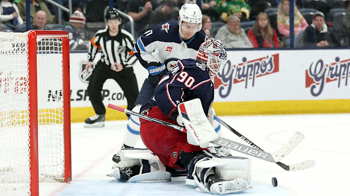 Blue Jackets goaltender Elvis Merzlikins makes a save against the Winnipeg Jets. Blue Jackets goaltender Elvis Merzlikins makes a save against the Winnipeg Jets.