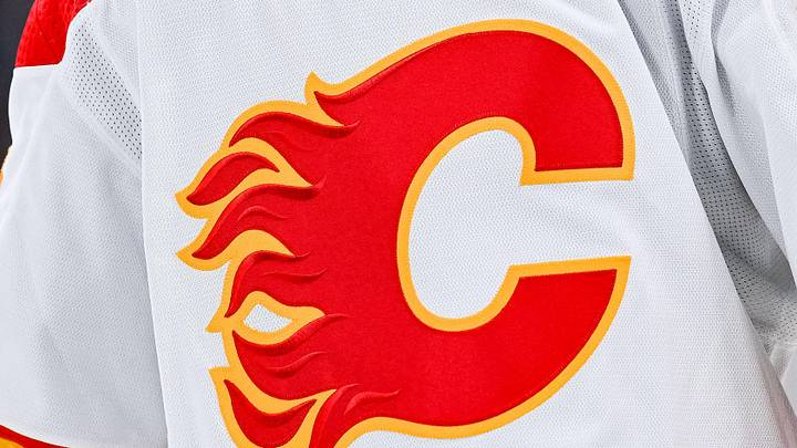 Dec 12, 2022; Montreal, Quebec, CAN; View of a Calgary Flames logo on a jersey worn by the member of the team during the second period at Bell Centre. Mandatory Credit: David Kirouac-Imagn Images