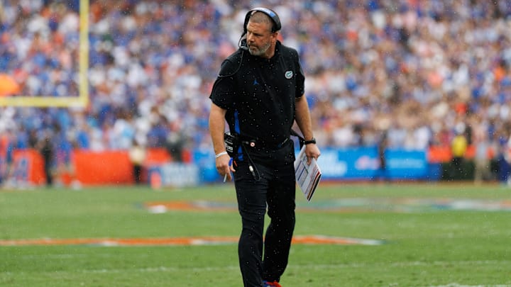 Oct 4, 2025; Gainesville, Florida, USA; Florida Gators head coach Billy Napier inspects the line of scrimmage against the Texas Longhorns during the first half at Ben Hill Griffin Stadium.