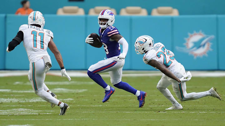 Nov 9, 2025; Miami Gardens, Florida, USA; Buffalo Bills wide receiver Elijah Moore (18) runs against Miami Dolphins safety Dante Trader Jr. (11) and cornerback Jack Jones (23) during the second half at Hard Rock Stadium