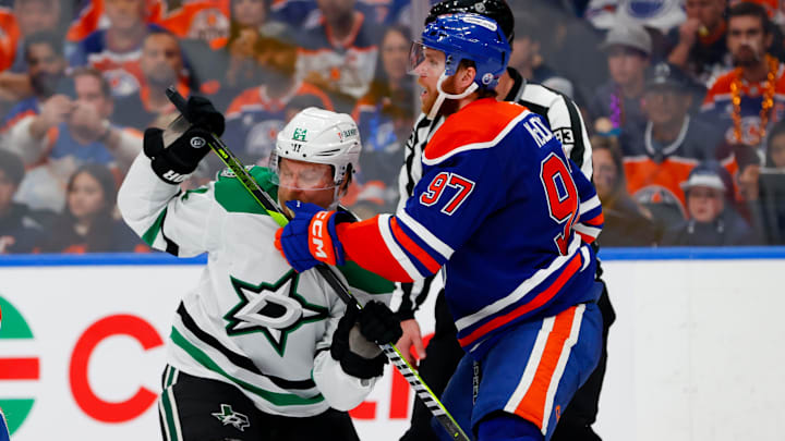 May 25, 2025; Edmonton, Alberta, CAN; Edmonton Oilers center Connor McDavid (97) checks Dallas Stars center Mikael Granlund (64) during the second period in game three of the Western Conference Final of the 2025 Stanley Cup Playoffs at Rogers Place. Mandatory Credit: Perry Nelson-Imagn Images