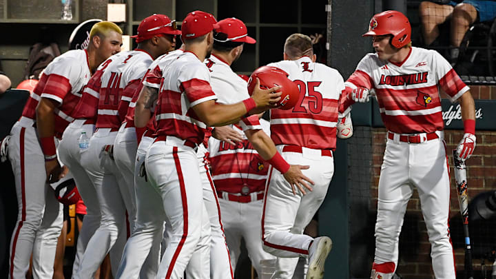 Louisville’s Matt Klein (25) is congratulated after hitting a home run off Vanderbilt pitcher Cody Bowker during the first inning of the Nashville Regional NCAA Baseball Tournament game at Hawkins Field Saturday, May 31, 2025, in Nashville, Tenn.