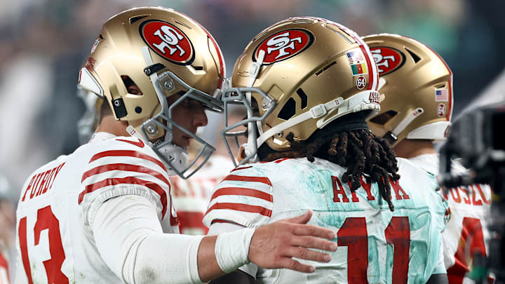 San Francisco 49ers quarterback Brock Purdy (L) and wide receiver Brandon Aiyuk (R)