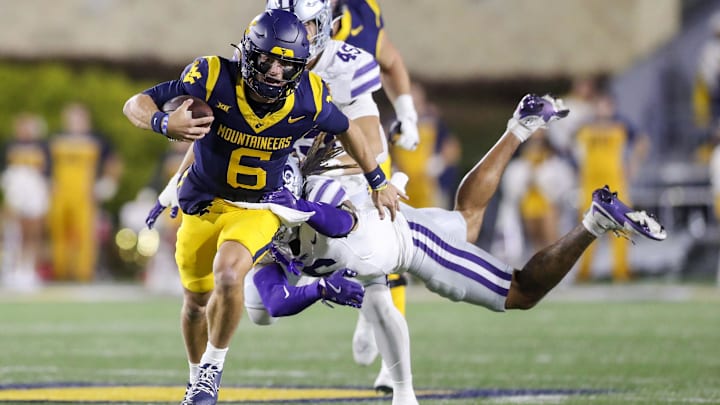 Oct 19, 2024; Morgantown, West Virginia, USA; West Virginia Mountaineers quarterback Garrett Greene (6) runs during the first quarter against the Kansas State Wildcats at Mountaineer Field at Milan Puskar Stadium. Mandatory Credit: Ben Queen-Imagn Images