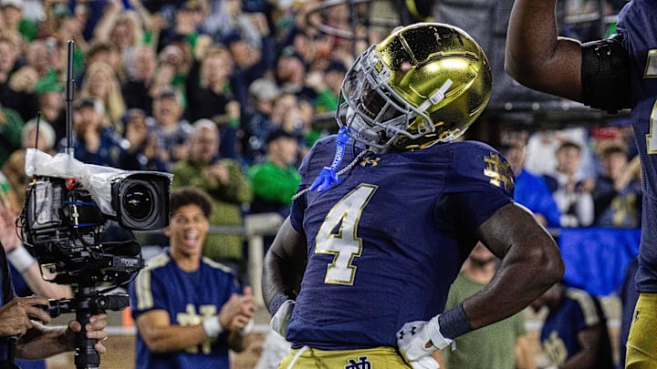 Oct 18, 2025; South Bend, Indiana, USA; Notre Dame Fighting Irish running back Jeremiyah Love (4) celebrates his  touchdown in the first half against the Southern California Trojans at Notre Dame Stadium. Mandatory Credit: Trevor Ruszkowski-Imagn Images