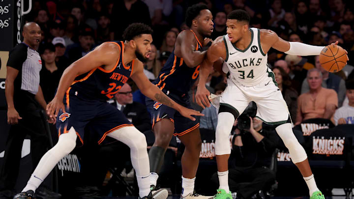 Nov 8, 2024; New York, New York, USA; Milwaukee Bucks forward Giannis Antetokounmpo (34) controls the ball against New York Knicks forward OG Anunoby (8) and center Karl-Anthony Towns (32) during the third quarter at Madison Square Garden. Mandatory Credit: Brad Penner-Imagn Images
