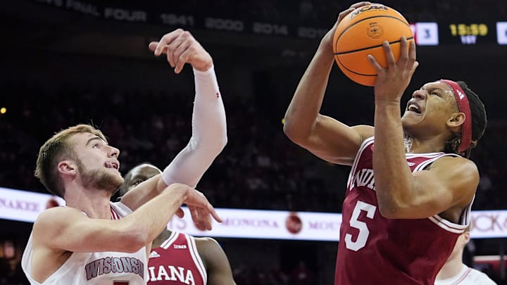 Wisconsin Badgers forward Tyler Wahl (5) attempts to block Indiana Hoosiers forward Malik Reneau (5)
