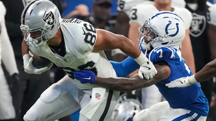 Oct 5, 2025; Indianapolis, Indiana, USA; Indianapolis Colts cornerback Charvarius Ward (7) attempts to bring down Las Vegas Raiders Albert Okwuegbunam Jr. (86) during a game at Lucas Oil Stadium. Mandatory Credit: Christine Tannous-USA TODAY Network via Imagn Images Oct 5, 2025; Indianapolis, Indiana, USA; Indianapolis Colts cornerback Charvarius Ward (7) attempts to bring down Las Vegas Raiders Albert Okwuegbunam Jr. (86) during a game at Lucas Oil Stadium. Mandatory Credit: Christine Tannous-USA TODAY Network via Imagn Images