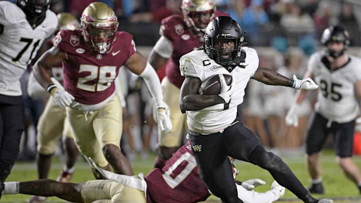 Nov 1, 2025; Tallahassee, Florida, USA; Wake Forest Demon Deacons running back Demond Claiborne (1) runs the ball during the first quarter against the Florida State Seminoles at Doak S. Campbell Stadium. Mandatory Credit: Melina Myers-Imagn Images