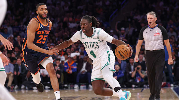 May 12, 2025; New York, New York, USA; Boston Celtics guard Jrue Holiday (4) dribbles in front of New York Knicks forward Mikal Bridges (25) in the second half during game four of the second round for the 2025 NBA Playoffs at Madison Square Garden. Mandatory Credit: Vincent Carchietta-Imagn Images