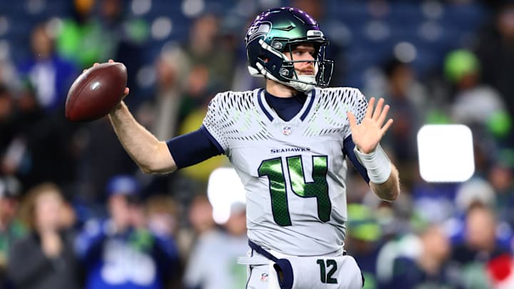 Dec 18, 2025; Seattle, Washington, USA; Seattle Seahawks quarterback Sam Darnold (14) warms up before the game against the Los Angeles Rams at Lumen Field. Mandatory Credit: Kevin Ng-Imagn Images