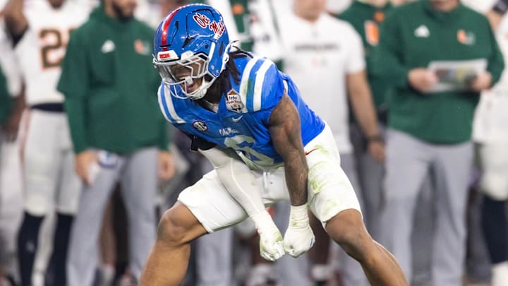 Jan 8, 2026; Glendale, AZ, USA; Mississippi Rebels linebacker TJ Dottery (6) celebrates a play against the Miami Hurricanes during the 2026 Fiesta Bowl and semifinal game of the College Football Playoff at State Farm Stadium. Mandatory Credit: Mark J. Rebilas-Imagn Images