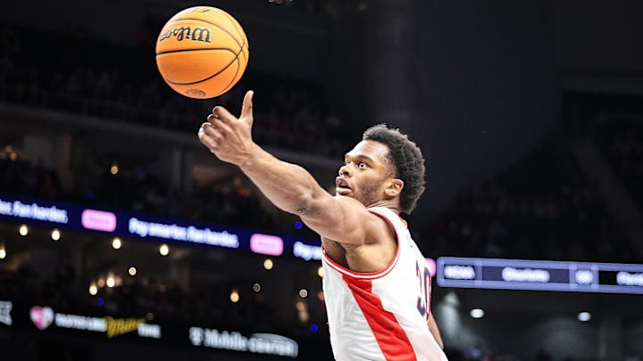 Mar 13, 2025; Kansas City, MO, USA; Arizona Wildcats forward Tobe Awaka (30) reaches for a pass during the first half against the Kansas Jayhawks at T-Mobile Center. Mandatory Credit: William Purnell-Imagn Images