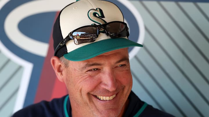 Seattle Mariners manager Dan Wilson (6) smiles in the dugout before the game against the Los Angeles Angels at Angel Stadium on July 25. Seattle Mariners manager Dan Wilson (6) smiles in the dugout before the game against the Los Angeles Angels at Angel Stadium on July 25.