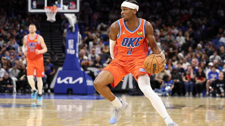 Dec 19, 2024; Orlando, Florida, USA; Oklahoma City Thunder guard Shai Gilgeous-Alexander (2) controls the ball against the Orlando Magic in the fourth quarter at Kia Center. Mandatory Credit: Nathan Ray Seebeck-Imagn Images