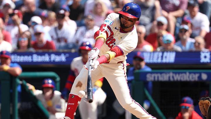 Sep 6, 2026; Philadelphia, Pennsylvania, USA; Philadelphia Phillies second baseman Luis Arraez (4) hits a single during the third inning against the Atlanta Braves at Citizens Bank Park. Mandatory Credit: Bill Streicher-Imagn Images