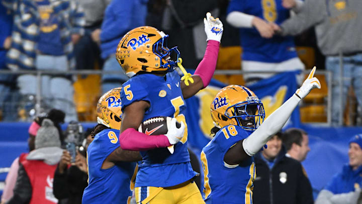 Oct 24, 2024; Pittsburgh, Pennsylvania, USA; Pittsburgh Panthers defensive back Phillip O'Brien Jr. (5) celebrates an interception against the Syracuse Orange during the third quarter at Acrisure Stadium. Mandatory Credit: Barry Reeger-Imagn Images
