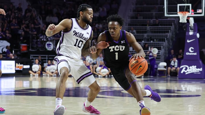 Feb 28, 2026; Manhattan, Kansas, USA; TCU Horned Frogs guard Jayden Pierre (1) is guarded by Kansas State Wildcats guard David Castillo (10) during the first half at Bramlage Coliseum. Mandatory Credit: Scott Sewell-Imagn Images