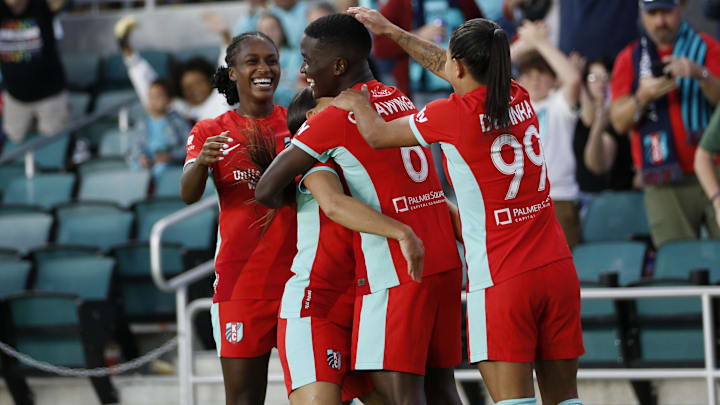  Kansas City Current forward Temwa Chawinga (6) celebrates with teammates after scoring a goal against Utah Royals FC during the first half at CPKC Stadium