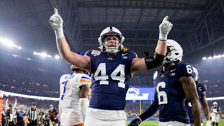 Dec 31, 2024; Glendale, AZ, USA; Penn State Nittany Lions tight end Tyler Warren (44) celebrates after scoring a touchdown against the Boise State Broncos in the Fiesta Bowl at State Farm Stadium. Mandatory Credit: Mark J. Rebilas-Imagn Images