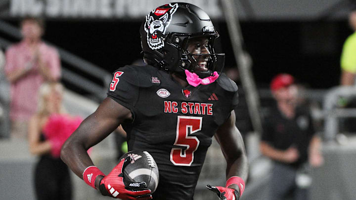 Oct 12, 2024; Raleigh, North Carolina, USA; North Carolina State Wolfpack safety DK Kaufman (5) celebrates a touchdown in the second half at Carter-Finley Stadium. Oct 12, 2024; Raleigh, North Carolina, USA; North Carolina State Wolfpack safety DK Kaufman (5) celebrates a touchdown in the second half at Carter-Finley Stadium.
