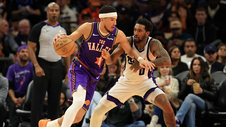 Mar 14, 2025; Phoenix, Arizona, USA; Phoenix Suns guard Devin Booker (1) against Sacramento Kings guard Malik Monk (0) at Footprint Center. Mandatory Credit: Mark J. Rebilas-Imagn Images Mar 14, 2025; Phoenix, Arizona, USA; Phoenix Suns guard Devin Booker (1) against Sacramento Kings guard Malik Monk (0) at Footprint Center. Mandatory Credit: Mark J. Rebilas-Imagn Images