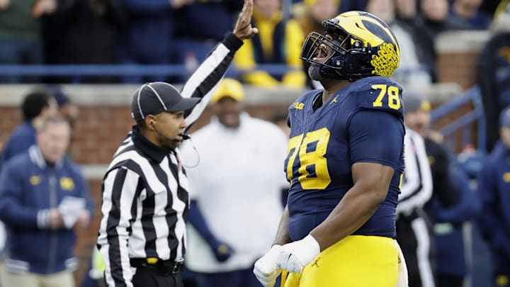Nov 23, 2024; Ann Arbor, Michigan, USA; Michigan Wolverines defensive lineman Kenneth Grant (78) celebrates after sacking Northwestern Wildcats quarterback Jack Lausch (not pictured) in the first half at Michigan Stadium. Mandatory Credit: Rick Osentoski-Imagn Images Nov 23, 2024; Ann Arbor, Michigan, USA; Michigan Wolverines defensive lineman Kenneth Grant (78) celebrates after sacking Northwestern Wildcats quarterback Jack Lausch (not pictured) in the first half at Michigan Stadium. Mandatory Credit: Rick Osentoski-Imagn Images