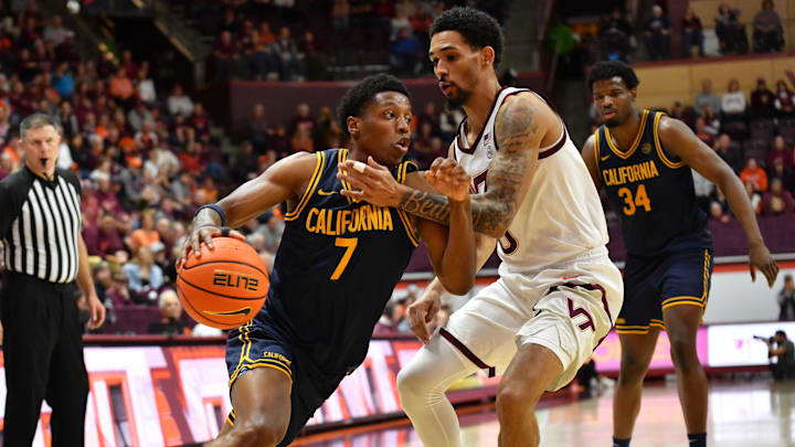 Jan 10, 2026; Blacksburg, Virginia, USA;  California Golden Bears guard Dai Dai Ames (7) drives to the basket defended by Virginia Tech Hokies guard Jailen Bedford (0) during the second half at Cassell Coliseum. Mandatory Credit: Brian Bishop-Imagn Images