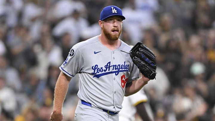 Jun 10, 2025; San Diego, California, USA; Los Angeles Dodgers relief pitcher Matt Sauer (64) reacts after giving up a run during the third inning against the San Diego Padres at Petco Park. Mandatory Credit: Denis Poroy-Imagn Images