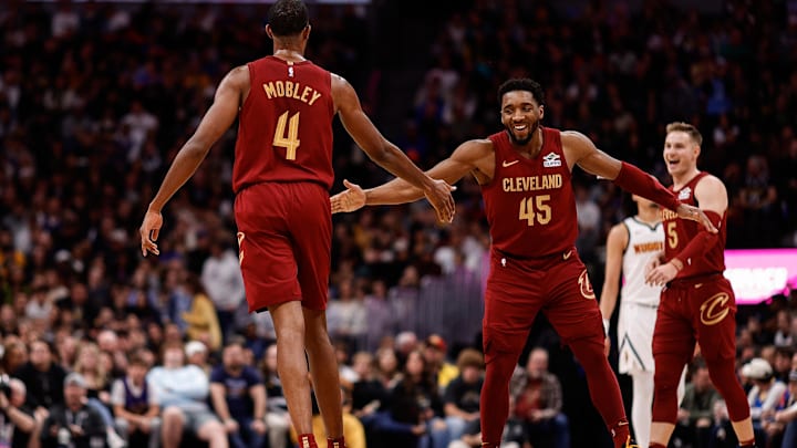 Dec 27, 2024; Denver, Colorado, USA; Cleveland Cavaliers guard Donovan Mitchell (45) reacts with forward Evan Mobley (4) after a play in the fourth quarter against the Denver Nuggets at Ball Arena. Mandatory Credit: Isaiah J. Downing-Imagn Images