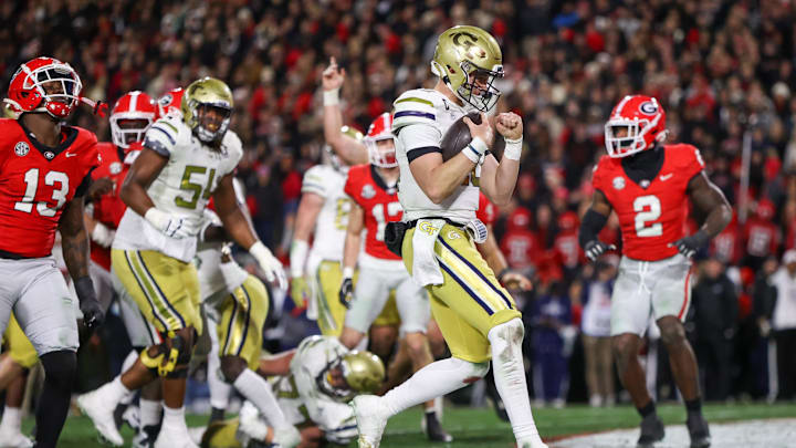 Nov 29, 2024; Athens, Georgia, USA; Georgia Tech Yellow Jackets quarterback Haynes King (10) runs for a touchdown against the Georgia Bulldogs in the second quarter at Sanford Stadium. Mandatory Credit: Brett Davis-Imagn Images