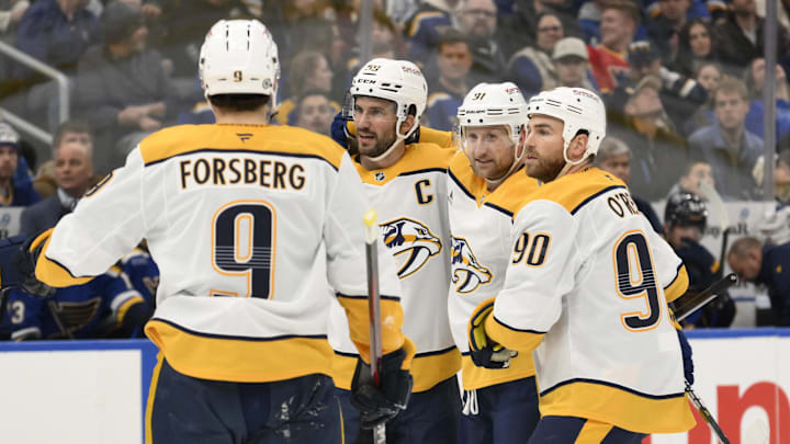 Dec 27, 2024; St. Louis, Missouri, USA; Nashville Predators center Steven Stamkos (91) is congratulated by teammates after scoring a goal against the St. Louis Blues during the first period at Enterprise Center. Mandatory Credit: Jeff Le-Imagn Images