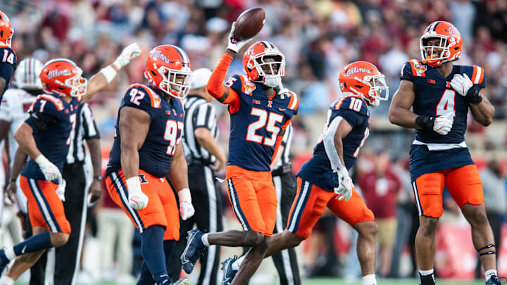 Dec 31, 2024; Orlando, FL, USA; Illinois Fighting Illini defensive back Jaheim Clarke (25) celebrates his fumble recovery against the South Carolina Gamecocks in the third quarter at Camping World Stadium. Mandatory Credit: Jeremy Reper-Imagn Images