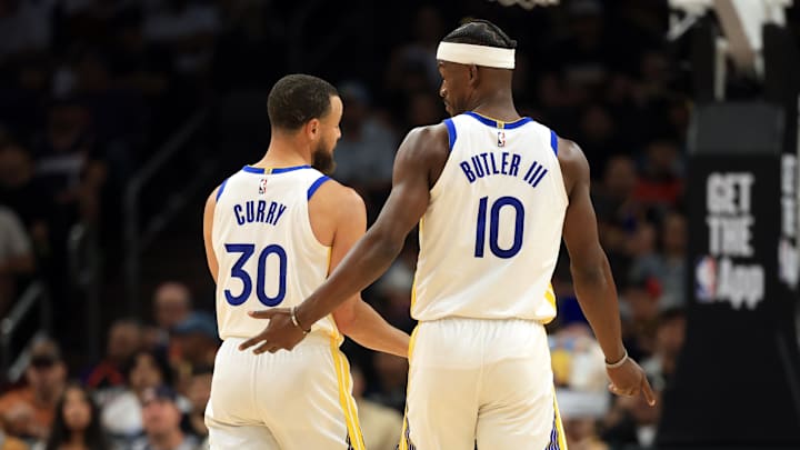 Apr 8, 2025; Phoenix, Arizona, USA; Golden State Warriors forward Jimmy Butler III (10) with guard Stephen Curry (30) against the Phoenix Suns at Footprint Center. Mandatory Credit: Mark J. Rebilas-Imagn Images