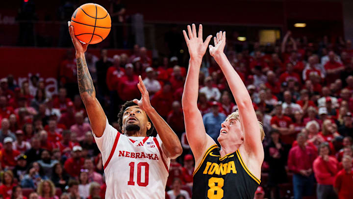 Nebraska guard Jamarques Lawrence shoots against Iowa forward Cooper Koch on March 8.