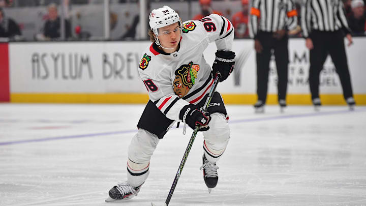 Mar 1, 2025; Anaheim, California, USA; Chicago Blackhawks center Connor Bedard (98) controls the puck against the Anaheim Ducks during the third period at Honda Center. Mandatory Credit: Gary A. Vasquez-Imagn Images