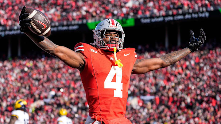 Ohio State wide receiver Jeremiah Smith (4) celebrates a touchdown against Michigan during the first half at Ohio Stadium in Columbus, Ohio on Saturday, Nov. 30, 2024. Ohio State wide receiver Jeremiah Smith (4) celebrates a touchdown against Michigan during the first half at Ohio Stadium in Columbus, Ohio on Saturday, Nov. 30, 2024.