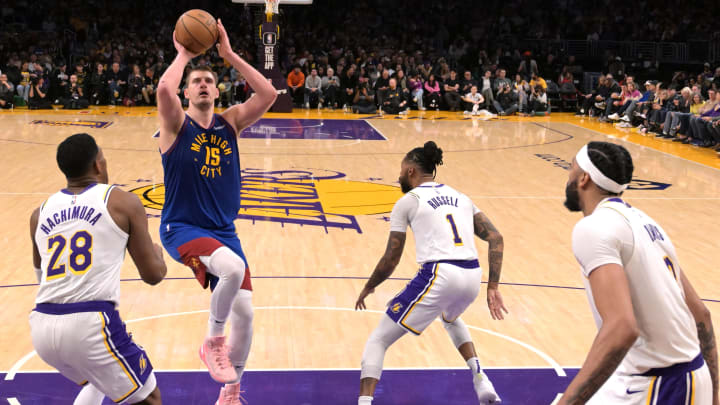 Mar 2, 2024; Los Angeles, California, USA;  Denver Nuggets center Nikola Jokic (15) shoots over the Los Angeles Lakers.