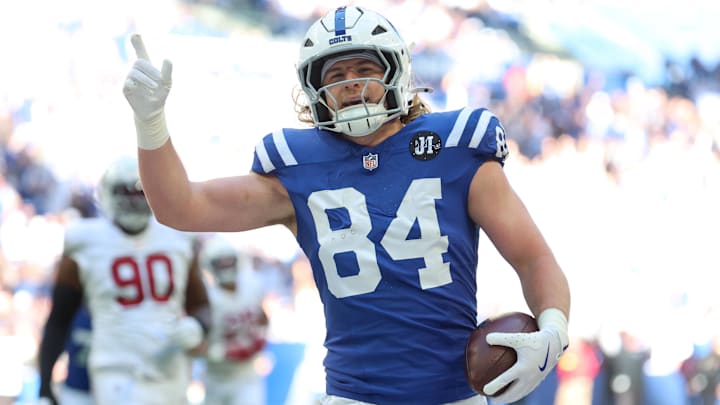 Oct 12, 2025; Indianapolis, Indiana, USA; Indianapolis Colts tight end Tyler Warren (84) celebrates after scoring a touchdown against the Arizona Cardinals during the first quarter of the game at Lucas Oil Stadium. Mandatory Credit: Trevor Ruszkowski-Imagn Images