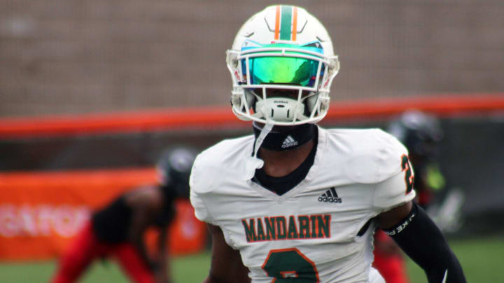 Mandarin wide receiver Jaime Ffrench Jr. (2) runs through warm-ups before the FHSAA Class 4M high school football championship game against Miami Columbus on December 8, 2023. [Clayton Freeman/Florida Times-Union]