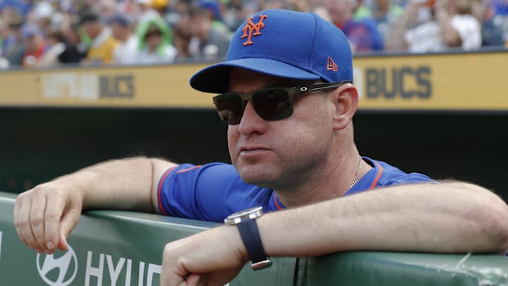 Jun 28, 2025; Pittsburgh, Pennsylvania, USA;  New York Mets manager Carlos Mendoza (64) looks over the dugout railing before the game against the Pittsburgh Pirates at PNC Park. Mandatory Credit: Charles LeClaire-Imagn Images