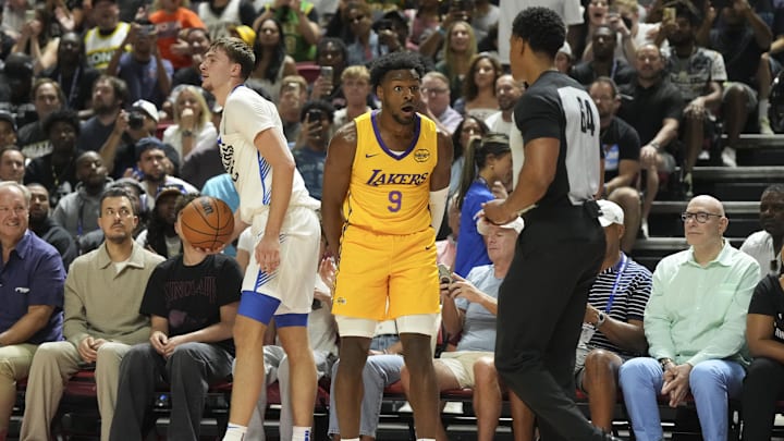 Jul 10, 2025; Las Vegas, NV, USA; Los Angeles Lakers guard Bronny James (9) reacts to a foul call against Dallas Mavericks forward Cooper Flagg (32) in the second quarter of their game at Thomas & Mack Center. Mandatory Credit: Candice Ward-Imagn Images